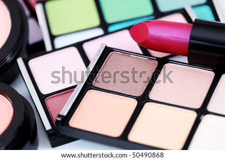 close-ups of different color of eyeshadows and lipstick - beauty treatment