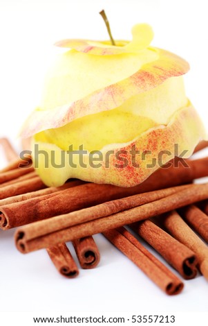 apple and cinnamon sticks on white - fruits and vegetables
