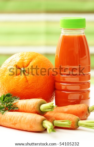 bottle of carrot and orange juice with fresh fruits - food and drink