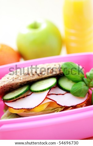 box with delicious sandwich and some fruits - food and drink