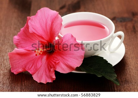 cup of hibiscus tea with beauty flower - tea time