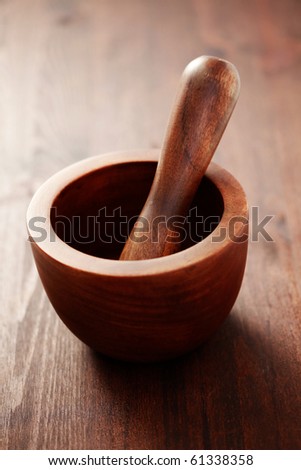 wooden brown mortar and pestle