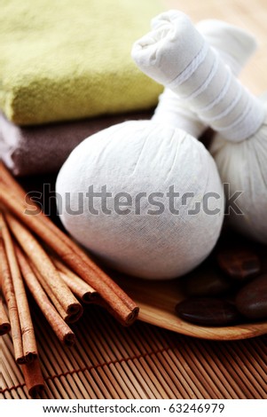 massage stamps with cinnamon sticks - beauty treatment