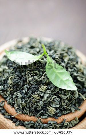bowl of dry green tea leaves - tea time