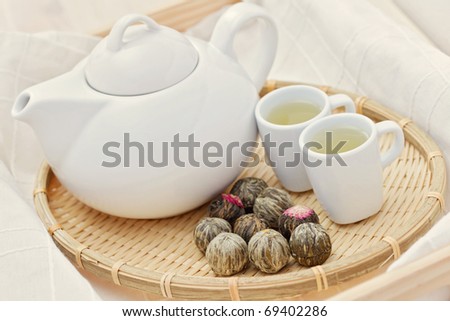 tea pot and cup of green tea - tea time