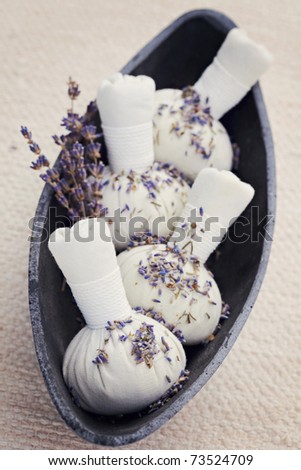 bowl of lavender massage stamps - beauty treatment