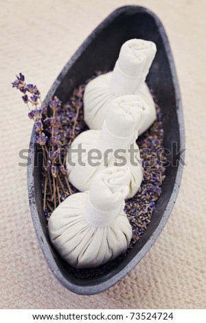 bowl of lavender massage stamps - beauty treatment