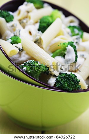 bowl of penne with broccoli and blue cheese sauce - food and drink