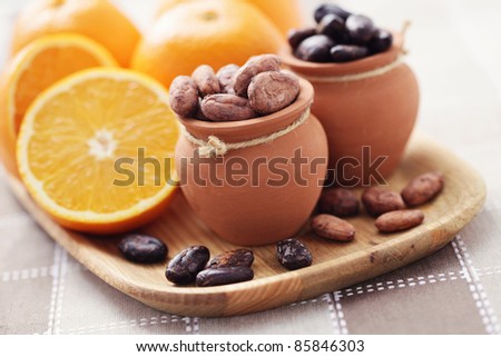 cocoa beans and fresh oranges - food and drink /shallow DOFF/