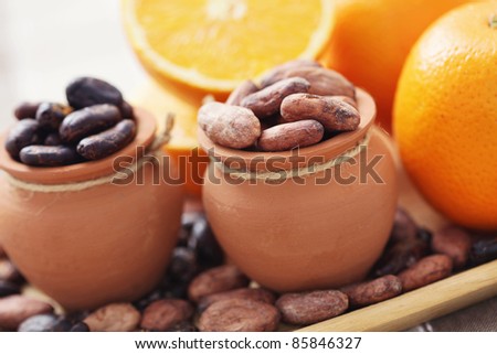 cocoa beans and fresh oranges - food and drink /shallow DOFF/