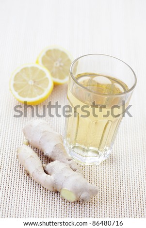 glass of ginger tea with lemon - tea time