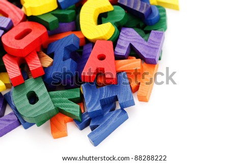 colorful wooden letters on white background - education