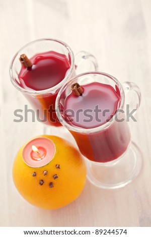 two glasses of hot wine with natural candlestick - food and drink /shallow DOFF/
