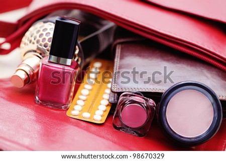 birth control pill in handbag - healthcare and medicine