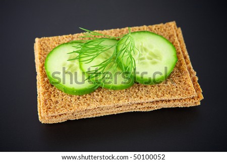 Cucumber sandwich on a black background