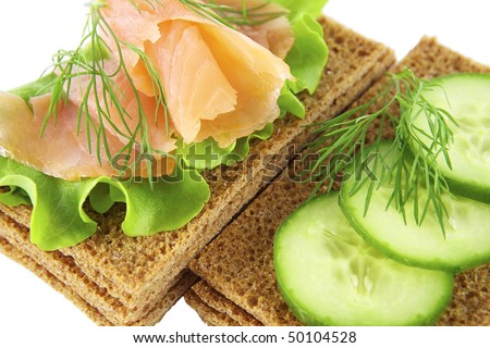 Sandwiches with salmon and  cucumber on a white background