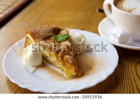 Apple pie with ice cream and cinnamon and coffee