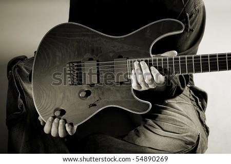 In the hands of a man regarded as an electric guitar