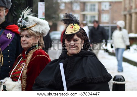 ROCHESTER CITY, KENT ,ENGLAND - DEC 11: Two elderly ladies dress in costumes from Dickens Festival in Rochester on December 11, 2010. The Dickens Festival is an annual event in Rochester.