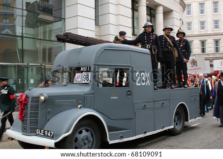 CITY OF LONDON, ENGLAND - NOVEMBER 12:  Old grey fire engine on parade at the Lord Mayor\'s Show in the City of London on November 12, 2010. The Lord Mayor\'s Show in an annual event in London.