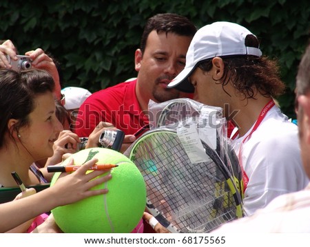 WIMBLEDON, ENGLAND - JUNE 24: Rapha Nadal meeting fans at the Wimbledon Lawn Tennis Tournament in Wimbledon, England on June 24, 2010. Rapha Nadal went on to win the tournament at Wimbledon.