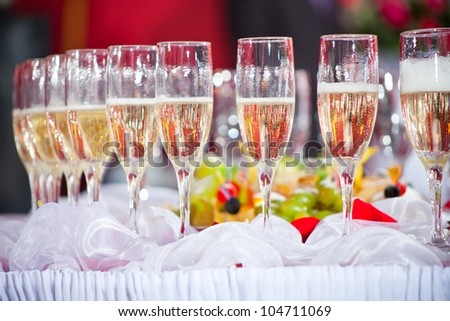 Close up photo with glasses of champagne on festive table