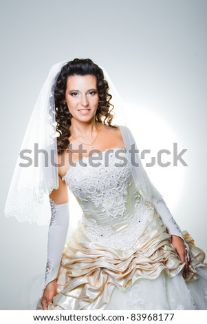 stock photo Studio portrait of attractive bride wearing elegant wedding