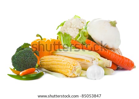 Still-life of autumn harvest with yellow, orange and green colors on isolated white background