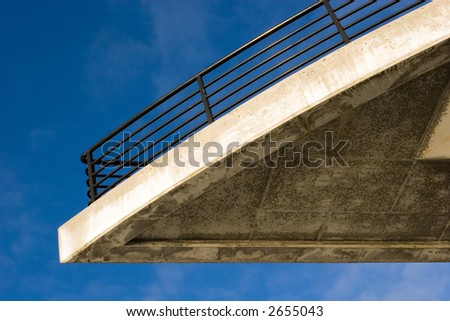 Concrete balcony against a blue sky