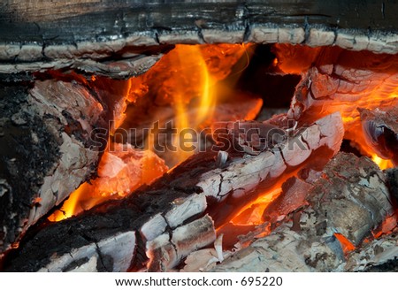 Texture of burning open fireplace with fire, flame, wood and embers