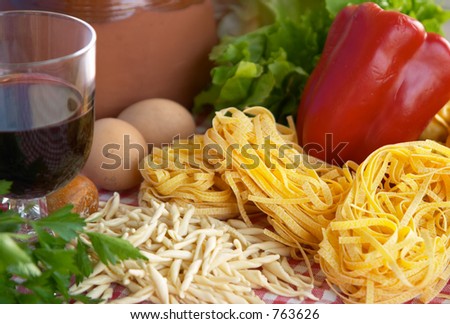 Pasta, vegetables, egg, wine, typical ingredients of Italian and Mediterranean food