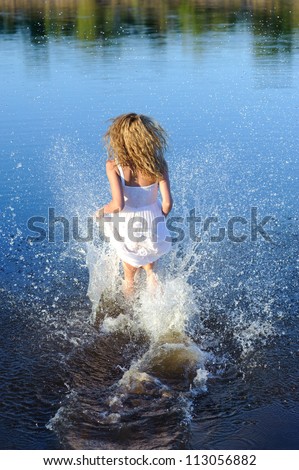 running active young woman in white dress