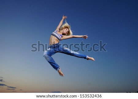 Professional gymnast woman jump at night