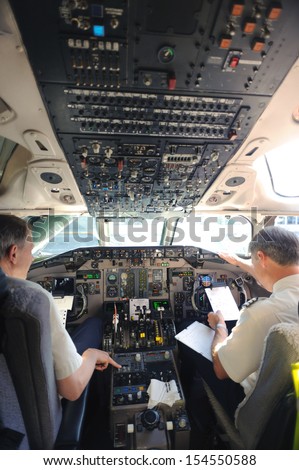 Helsinki, Finland - June 7, 2011: Pilots Preparing Aircraft For Take-Off From The Airport Helsinki On June 7, 2011. Cockpit With Captains Of The Flight
