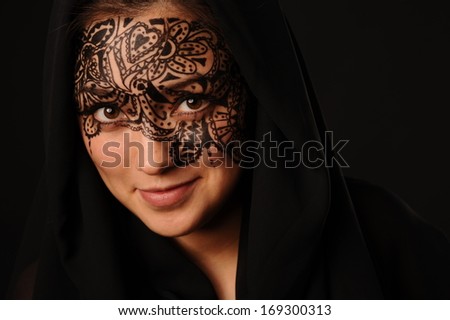 Arabic style portrait of young beauty woman with tracery on the face