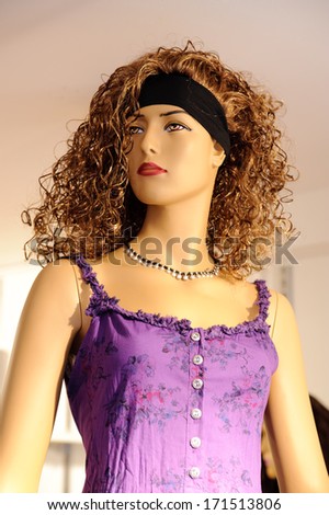 Fashion woman mannequin in violet dress