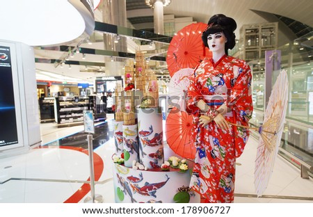 DUBAI - SEPTEMBER 26: japanese geisha mannequin in Duty Free shop in Dubai Airport on September 26, 2013 in Dubai, UAE. Emirates handles major part of passenger traffic