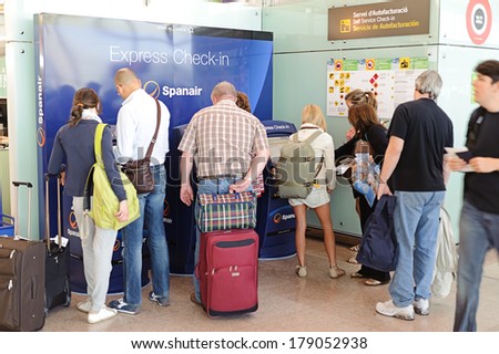 BARCELONA, SPAIN - JUNE 12, 2011: express check-in kiosks of Spanair in Barcelona International Airport on June 12, 2011 in Spain. Spanair S.A. was a Spanish airline. The last passenger flight was JK1326