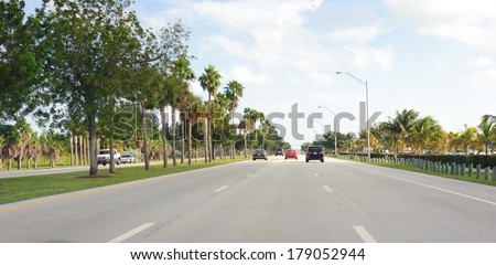 MIAMI, FLORIDA - DEC 24, 2009: Cars on road. Miami is a city located on the Atlantic coast in southeastern Florida and the county seat of Miami-Dade County