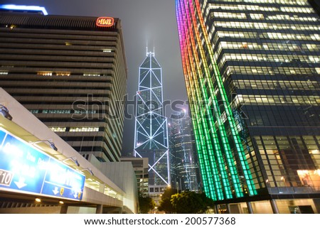 HONG KONG - APRIL 21: Hong Kong downtown skyscrapers at night on April 21, 2014 in Hong Kong, China. Hong Kong alternatively known by its initials H.K., is situated on China\'s south coast.