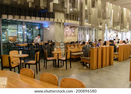 SHENZHEN, CHINA-APRIL 13: Starbucks Cafe interior on April 13, 2014 in Shenzhen, China. Starbucks Corporation is an American global coffee company and coffeehouse chain based in Seattle, Washington