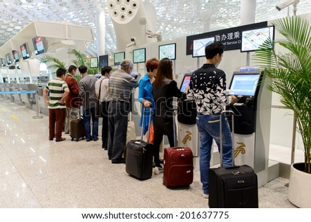 SHENZHEN - APRIL 16: airport interior on April 16, 2014 in Shenzhen, China. Shenzhen Bao\'an International Airport is located near Huangtian and Fuyong villages in Bao\'an District, Shenzhen, Guangdong