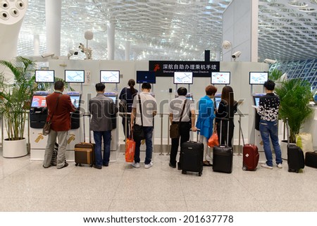 SHENZHEN, CHINA - APRIL 16: airport interior on April 16, 2014 in Shenzhen, China. Shenzhen Bao\'an International Airport is located near Huangtian and Fuyong villages in Bao\'an District, Shenzhen, Guangdong