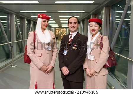 MOSCOW -JUNE 04: Emirates crew members after landing on June 04, 2014 in Moscow, Russia. Emirates handles major part of passenger traffic and aircraft movements at the airport.