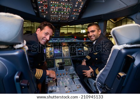HONG KONG, CHINA - MAY 16, 2014: pilots in Emirates Airbus A380 aircraft after landing on May 16, 2014. Emirates is the largest airline in the Middle East