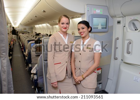 DUBAI - MAY 16: Emirates crew members in Airbus A380 aircraft on May 16, 2014 in Dubai, UAE. Emirates handles major part of passenger traffic and aircraft movements at the airport.