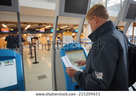 HELSINKI - SEP 03: self check-in kiosks on September 03, 2014 in Helsinki, Finland. Helsinki Airport  is the main international airport of the Helsinki metropolitan region and the whole of Finland