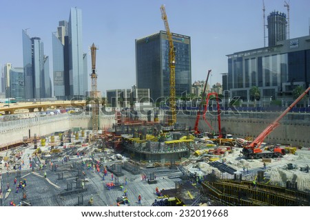 DUBAI - OCTOBER 15: construction activity in Dubai downtown on October 15, 2014 in Dubai, UAE. Dubai is the most populous city and emirate in the United Arab Emirates
