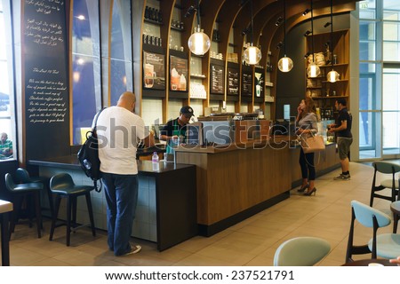 DUBAI - OCTOBER 15: Starbucks Cafe interior in the Dubai Mall on October 15, 2014 in Dubai, UAE. Starbucks is the largest coffeehouse company in the world, with more then 23000 stores