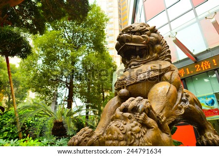 SHENZHEN, CHINA - JAN 06: lion guarding near Bank of China on January 06, 2015. Bank of China Limited is one of the 5 biggest state-owned commercial banks in the People\'s Republic of China.